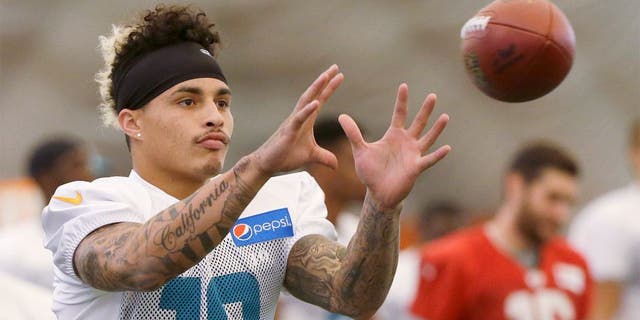 Miami Dolphins wide receiver Kenny Stills catches the ball as he warms up during an NFL football training camp practice, Monday, Aug. 10, 2015 in Davie, Fla. (AP Photo/Wilfredo Lee)