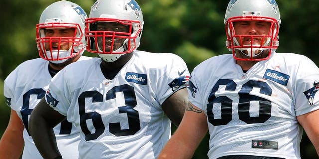 Aug 6, 2015; Foxborough, MA, USA; New England Patriots offensive guard Tre Jackson (63) with guard Josh Kline (67) and center Bryan Stork (66) during training camp at Gillette Stadium. Mandatory Credit: Winslow Townson-USA TODAY Sports