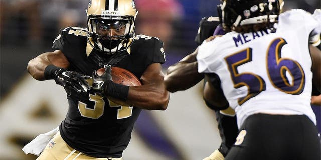 Aug 13, 2015; Baltimore, MD, USA; New Orleans Saints running back Tim Hightower (34) runs with the ball during the third quarter against the Baltimore Ravens in a preseason NFL football game at M&amp;T Bank Stadium. Mandatory Credit: Tommy Gilligan-USA TODAY Sports