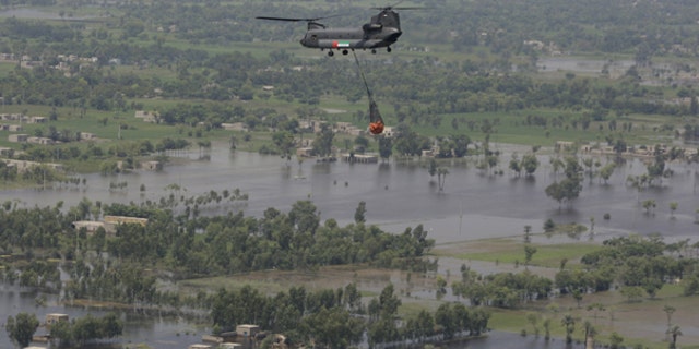 Aug. 18: A United Arab Emirates Chinook carries food supply over Punjab province. Pakistan senior meteorologist Arif Mahmood said floodwaters won't fully recede until the end of the month, and existing river torrents were still heading toward major cities in the country's south.