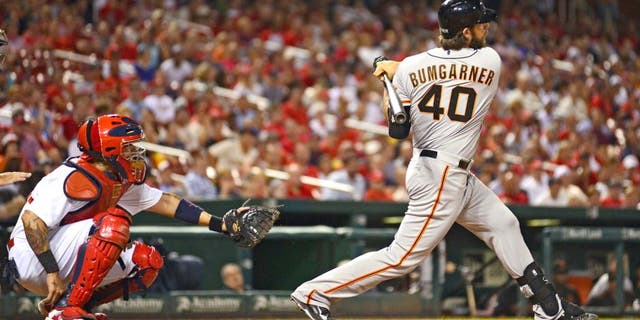 Aug 18, 2015; St. Louis, MO, USA; San Francisco Giants pinch hitter Madison Bumgarner (40) hit s a single off of St. Louis Cardinals starting pitcher Lance Lynn (not pictured) during the seventh inning at Busch Stadium. Mandatory Credit: Jeff Curry-USA TODAY Sports