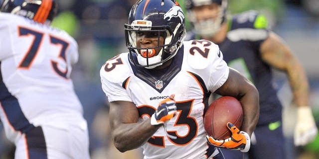 August 14, 2015; Seattle, WA, USA; Denver Broncos running back Ronnie Hillman (23) runs the ball against the Seattle Seahawks during the first half in a preseason NFL football game at CenturyLink Field. Mandatory Credit: Gary A. Vasquez-USA TODAY Sports