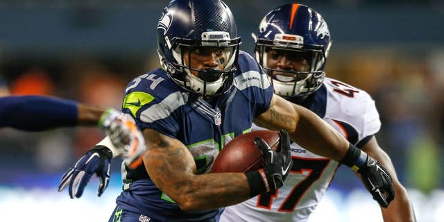 SEATTLE, WA - AUGUST 14: Running back Thomas Rawls #34 of the Seattle Seahawks rushes for a touchdown in the fourth quarter against the Denver Broncos at CenturyLink Field on August 14, 2015 in Seattle, Washington. The Broncos defeated the Seahawks 22-20. (Photo by Otto Greule Jr/Getty Images)