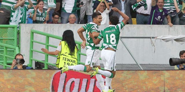 LISBON, PORTUGAL - AUGUST 18: Sporting's forward Teofilo Gutierrez celebrates scoring a goal with Sporting's forward Andre Carrillo during the UEFA Champions League qualifying round play-off first leg match between Sporting CP and CSKA Moscow at Estadio Jose Alvalade on August 18, 2015 in Lisbon, Portugal. (Photo by Carlos Rodrigues/Getty Images)
