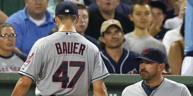 Trevor Bauer leaves the baseball game after being taken out during the second inning after giving up five runs vs. the Boston Red Sox