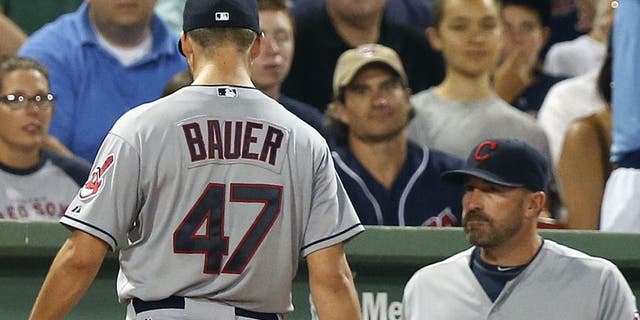 Trevor Bauer leaves the baseball game after being taken out during the second inning after giving up five runs vs. the Boston Red Sox