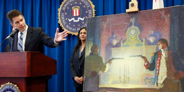 Aug. 18, 2015: David Bowdich FBI Assistant Director in Charge, left, and and FBI Special Agent Elizabeth Rivas speak at a news conference in Los Angeles.