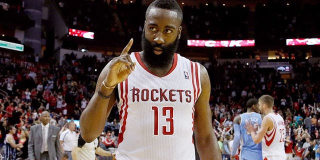 Apr 6, 2014; Houston, TX, USA; Houston Rockets guard James Harden (13) holds up one finger following the Houston Rockets 130-125 overtime win against the Denver Nuggets at Toyota Center. Mandatory Credit: Andrew Richardson-USA TODAY Sports