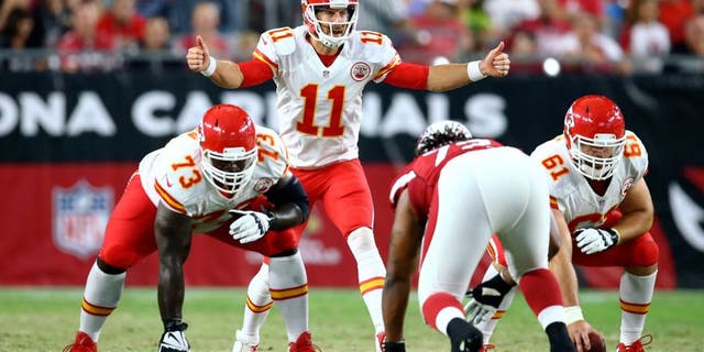 Aug 15, 2015; Glendale, AZ, USA; Kansas City Chiefs quarterback Alex Smith (11) reacts as he calls a play against the Arizona Cardinals during a preseason NFL football game at University of Phoenix Stadium. Mandatory Credit: Mark J. Rebilas-USA TODAY Sports