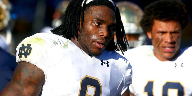 Nov 8, 2014; Tempe, AZ, USA; Notre Dame Fighting Irish linebacker Jaylon Smith (9) and safety Max Redfield (10) against the Arizona State Sun Devils at Sun Devil Stadium. Arizona State defeated Notre Dame 55-31. Mandatory Credit: Mark J. Rebilas-USA TODAY Sports