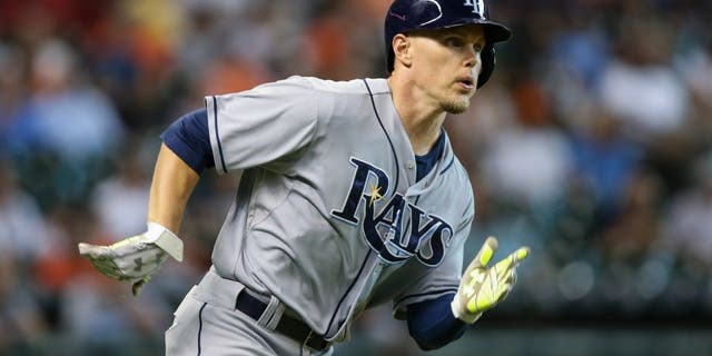 Aug 19, 2015; Houston, TX, USA; Tampa Bay Rays center fielder Brandon Guyer (5) hits a double during the first inning against the Houston Astros at Minute Maid Park. Mandatory Credit: Troy Taormina-USA TODAY Sports