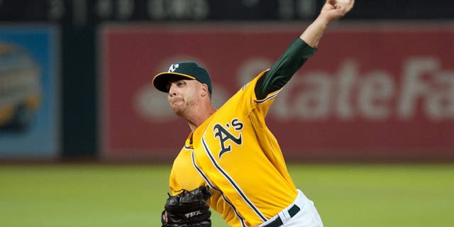 Aug 1, 2014; Oakland, CA, USA; Oakland Athletics relief pitcher Eric O'Flaherty (39) throws a pitch against the Kansas City Royals during the eighth inning at O.co Coliseum. The Kansas City Royals defeated the Oakland Athletics 1-0. Mandatory Credit: Ed Szczepanski-USA TODAY Sports