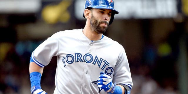 Aug 20, 2014; Milwaukee, WI, USA; Toronto Blue Jays right fielder Jose Bautista (19) runs the bases after hitting a 3-run home run in the sixth inning against the Milwaukee Brewers at Miller Park. Mandatory Credit: Benny Sieu-USA TODAY Sports