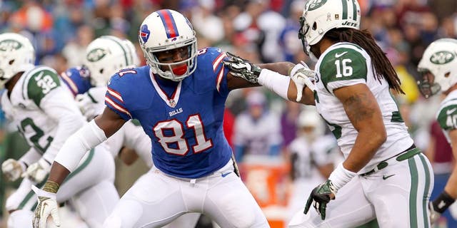 Nov 17, 2013; Orchard Park, NY, USA; Buffalo Bills wide receiver Marcus Easley (81) blocks New York Jets wide receiver Josh Cribbs (16) during the second half at Ralph Wilson Stadium. Bills beat the Jets 37 to 14. Mandatory Credit: Timothy T. Ludwig-USA TODAY Sports