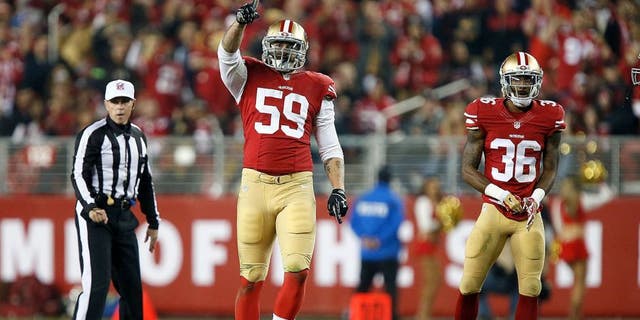 SANTA CLARA, CA - NOVEMBER 27: Aaron Lynch #59 of the San Francisco 49ers celebrates after a sack against the Seattle Seahawks at Levi's Stadium on November 27, 2014 in Santa Clara, California. (Photo by Brian Bahr/Getty Images)