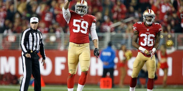SANTA CLARA, CA - NOVEMBER 27: Aaron Lynch #59 of the San Francisco 49ers celebrates after a sack against the Seattle Seahawks at Levi's Stadium on November 27, 2014 in Santa Clara, California. (Photo by Brian Bahr/Getty Images)