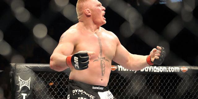 LAS VEGAS - JULY 11: Brock Lesnar reacts after knocking out Frank Mir during their heavyweight title bout during UFC 100 on July 11, 2009 in Las Vegas, Nevada. (Photo by Jon Kopaloff/Getty Images) *** Local Caption *** Brock Lesnar