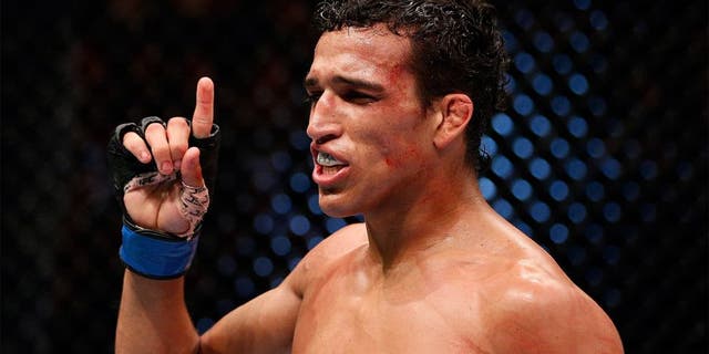 AUCKLAND, NEW ZEALAND - JUNE 28: Charles Oliveira reacts after his submission victory over Hatsu Hioki in their featherweight fight during the UFC Fight Night event at Vector Arena on June 28, 2014 in Auckland, New Zealand. (Photo by Josh Hedges/Zuffa LLC/Zuffa LLC via Getty Images) *** Local Caption *** Charles Oliveira