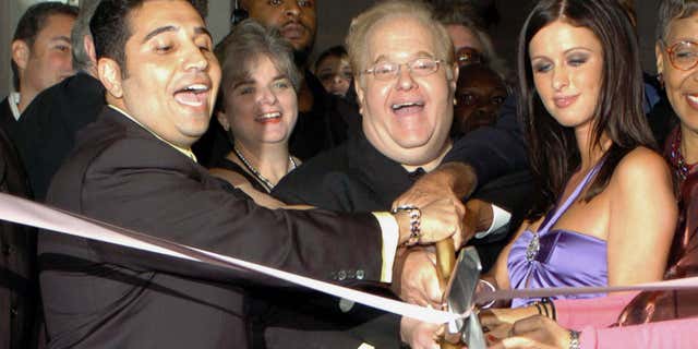 Dec. 30, 2004: Orlando business man Fred Khalilian (L) entertainment mogul Lou Pearlman (C) and hotel heiress Nicky Hilton (R) cut the ribbon at the grand opening of Club Paris in Orlando, Fla.
