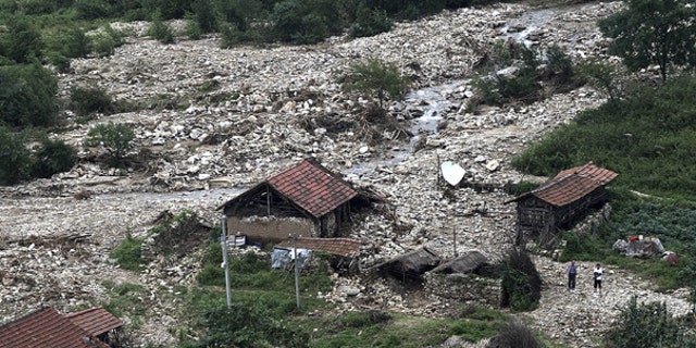 Aug. 22: This photo released by China's Xinhua news agency shows the bird's-eye view of a damaged village after flood in northeast China. Flooding has forced the evacuation of 94,000 people in the north China port city of Dandong after heavy rains caused the Yalu river to breach its banks.