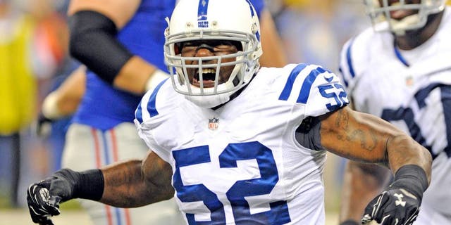 Aug 16, 2014; Indianapolis, IN, USA; Indianapolis Colts linebacker D'Qwell Jackson(52) reacts to a first half sack of New York Giants quarterback Eli Manning (not pictured) during their pre season game at Lucas Oil Stadium. Mandatory Credit: Thomas J. Russo-USA TODAY Sports