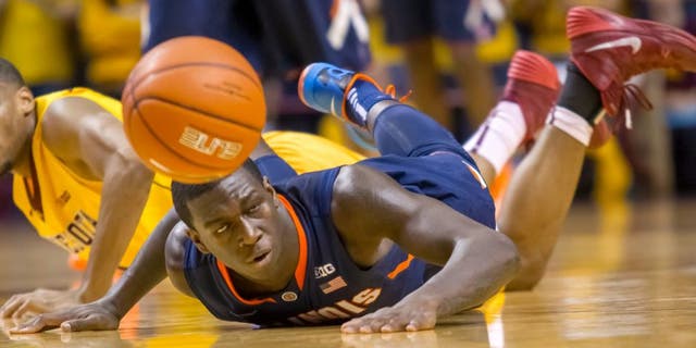Feb 19, 2014; Minneapolis, MN, USA; Illinois Fighting Illini forward Darius Paul (35) dives for a loose ball in the first half against the Minnesota Gophers at Williams Arena. Mandatory Credit: Brad Rempel-USA TODAY Sports