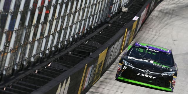 BRISTOL, TN - AUGUST 21: Denny Hamlin, driver of the #11 FedEx Ground Toyota, practices for the NASCAR Sprint Cup Series Irwin Tools Night Race at Bristol Motor Speedway on August 21, 2015 in Bristol, Tennessee. (Photo by Sean Gardner/Getty Images)