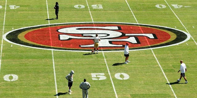 SANTA CLARA, CA - AUGUST Personel stand on the new turf before the San Francisco 49ers play against the San Diego Chargers during a preseason game at Levi's Stadium on August 24, 2014 in Santa Clara, California. (Photo by Noah Graham/Getty Images)