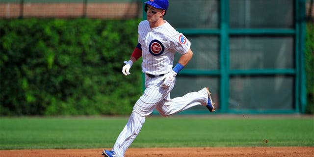 CHICAGO, IL - AUGUST 21: Chris Coghlan #8 of the Chicago Cubs runs the bases after hitting a home run against the Atlanta Braves during the first inning on August 21, 2015 at Wrigley Field in Chicago, Illinois. (Photo by David Banks/Getty Images)