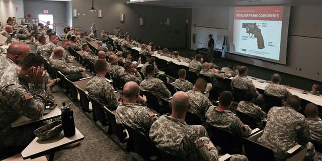 Aug. 3, 2015: Members of the Indiana Nation Guard undergo National Rifle Association firearm training in the auditorium of the Johnson County Armory in Franklin, Ind.