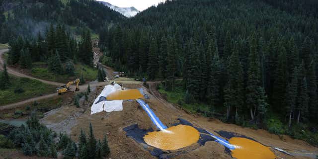 Aug. 12, 2015: Water flows through a series of retention ponds built to contain and filter out heavy metals and chemicals from the Gold King mine chemical accident, in the spillway about 1/4 mile downstream from the mine, outside Silverton, Colo.