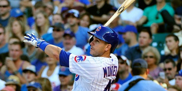 CHICAGO, IL - AUGUST 22: Miguel Montero #47 of the Chicago Cubs hits a home run against the Atlanta Braves during the eighth inning on August 22, 2015 at Wrigley Field in Chicago, Illinois. The Cubs won 9-7.(Photo by David Banks/Getty Images)