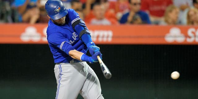 Toronto Blue Jays' Josh Donaldson hits an RBI single during the fourth inning of a baseball game against the Los Angeles Angels, Saturday, Aug. 22, 2015, in Anaheim, Calif. (AP Photo/Mark J. Terrill)
