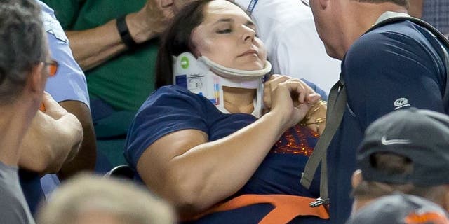 DETROIT, MI - AUGUST 21: A fan is carried out by medics after getting hit in the side of her head by a foul ball in the eighth inning during a MLB game between the Detroit Tigers and the Texas Rangers at Comerica Park on August 21, 2015 in Detroit, Michigan.(Photo by Dave Reginek/Getty Images)