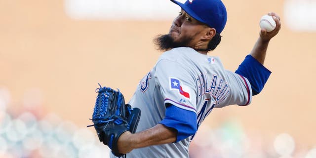 Aug 22, 2015; Detroit, MI, USA; Texas Rangers starting pitcher Yovani Gallardo (49) pitches in the first inning against the Detroit Tigers at Comerica Park. Mandatory Credit: Rick Osentoski-USA TODAY Sports