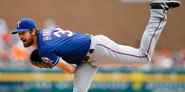 Aug 23, 2015; Detroit, MI, USA; Texas Rangers starting pitcher Cole Hamels (35) pitches in the first inning against the Detroit Tigers at Comerica Park. Mandatory Credit: Rick Osentoski-USA TODAY Sports