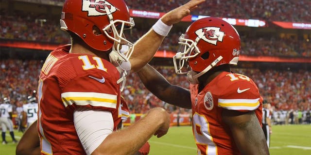 Aug 21, 2015; Kansas City, MO, USA; Kansas City Chiefs wide receiver Jeremy Maclin (19) celebrates with quarterback Alex Smith (11) after catching a touchdown pass against the Seattle Seahawks in the first half at Arrowhead Stadium. Mandatory Credit: John Rieger-USA TODAY Sports