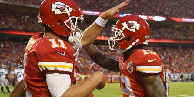 Aug 21, 2015; Kansas City, MO, USA; Kansas City Chiefs wide receiver Jeremy Maclin (19) celebrates with quarterback Alex Smith (11) after catching a touchdown pass against the Seattle Seahawks in the first half at Arrowhead Stadium. Mandatory Credit: John Rieger-USA TODAY Sports