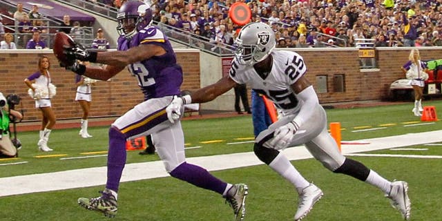 Aug 22, 2015; Minneapolis, MN, USA; Minnesota Vikings wide receiver Charles Johnson (12) catches a pass past Oakland Raiders cornerback D.J. Hayden (25) for a touchdown in the second quarter at TCF Bank Stadium. Mandatory Credit: Bruce Kluckhohn-USA TODAY Sports