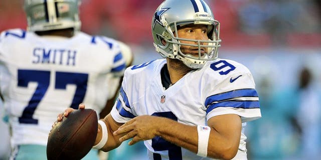 MIAMI GARDENS, FL - AUGUST 23: Quarterback Tony Romo #9 of the Dallas Cowboys looks for a receiver during a preseason game against the Miami Dolphins at Sun Life Stadium on August 23, 2014 in Miami Gardens, Florida. (Photo by Ronald C. Modra/Sports Imagery/ Getty Images)