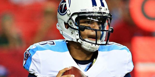 ATLANTA, GA - AUGUST 14: Marcus Mariota #8 of the Tennessee Titans rolls out on a pass play in the first half of a preseason game against the Atlanta Falcons at the Georgia Dome on August 14, 2015 in Atlanta, Georgia. (Photo by Daniel Shirey/Getty Images)