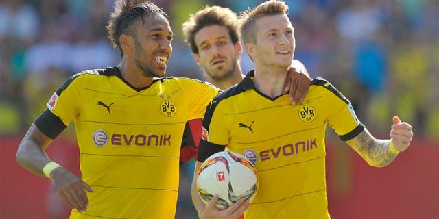 INGOLSTADT, GERMANY - AUGUST 23: Marco Reus (R) and Pierre-Emerick Aubameyang of Borussia Dortmund celebrate their team's second goal during the Bundesliga match between FC Ingolstadt and Borussia Dortmund at Audi Sportpark on August 23, 2015 in Ingolstadt, Germany. (Photo by Lennart Preiss/Bongarts/Getty Images)