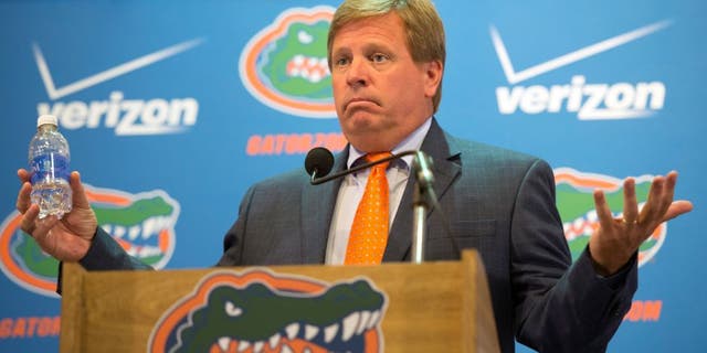 FILE - In this Aug. 5, 2015, file photo, Florida NCAA college football coach Jim McElwain speaks to the media during the teams media day in Gainesville, Fla. McElwain has offered few details about his revamped offense this fall, quite possibly because he knows it could be another long season for the Gators. (AP Photo/Phil Sandlin, File)