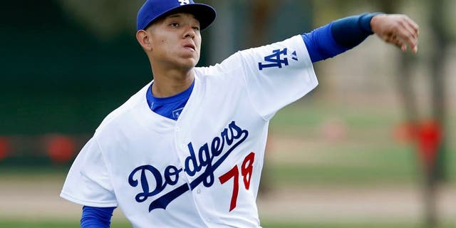 Feb 23, 2015; Glendale, AZ, USA; Los Angeles Dodgers pitcher Julio Urias (78) throws in the bullpen during camp at Camelback Ranch. Mandatory Credit: Rick Scuteri-USA TODAY Sports