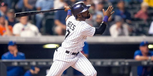 DENVER, CO - AUGUST 22: Jose Reyes #7 of the Colorado Rockies watches the flight of a sixth inning solo homerun against the New York Mets during a game at Coors Field on August 22, 2015 in Denver, Colorado. (Photo by Dustin Bradford/Getty Images)