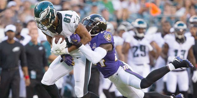Aug 22, 2015; Philadelphia, PA, USA; Philadelphia Eagles wide receiver Jordan Matthews (81) catches the ball in front of the defense of Baltimore Ravens defensive back Kyle Arrington (24) at Lincoln Financial Field. Mandatory Credit: Bill Streicher-USA TODAY Sports