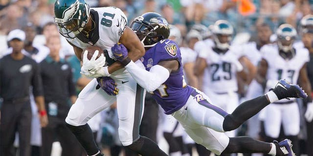 Aug 22, 2015; Philadelphia, PA, USA; Philadelphia Eagles wide receiver Jordan Matthews (81) catches the ball in front of the defense of Baltimore Ravens defensive back Kyle Arrington (24) at Lincoln Financial Field. Mandatory Credit: Bill Streicher-USA TODAY Sports