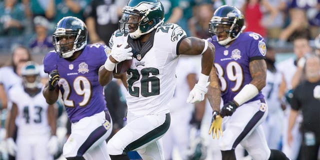 Aug 22, 2015; Philadelphia, PA, USA; Philadelphia Eagles defensive back Walter Thurmond (26) runs with the ball after an interception against the Baltimore Ravens during the first quarter at Lincoln Financial Field. Mandatory Credit: Bill Streicher-USA TODAY Sports