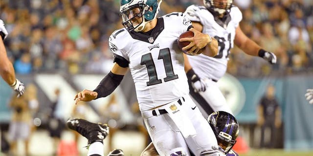 Aug 22, 2015; Philadelphia, PA, USA; Philadelphia Eagles quarterback Tim Tebow (11) is sacked by Baltimore Ravens linebacker Za'Darius Smith (90) during the second half at Lincoln Financial Field. The Eagles defeated the Ravens, 40-17. Mandatory Credit: Eric Hartline-USA TODAY Sports