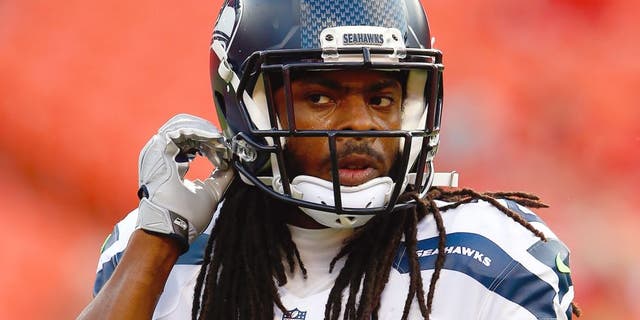KANSAS CITY, MO - AUGUST 21: Cornerback Richard Sherman #25 of the Seattle Seahawks warms up prior to the start of the preaseason game against the Kansas City Chiefs at Arrowhead Stadium on August 21, 2015 in Kansas City, Missouri. (Photo by Jamie Squire/Getty Images)